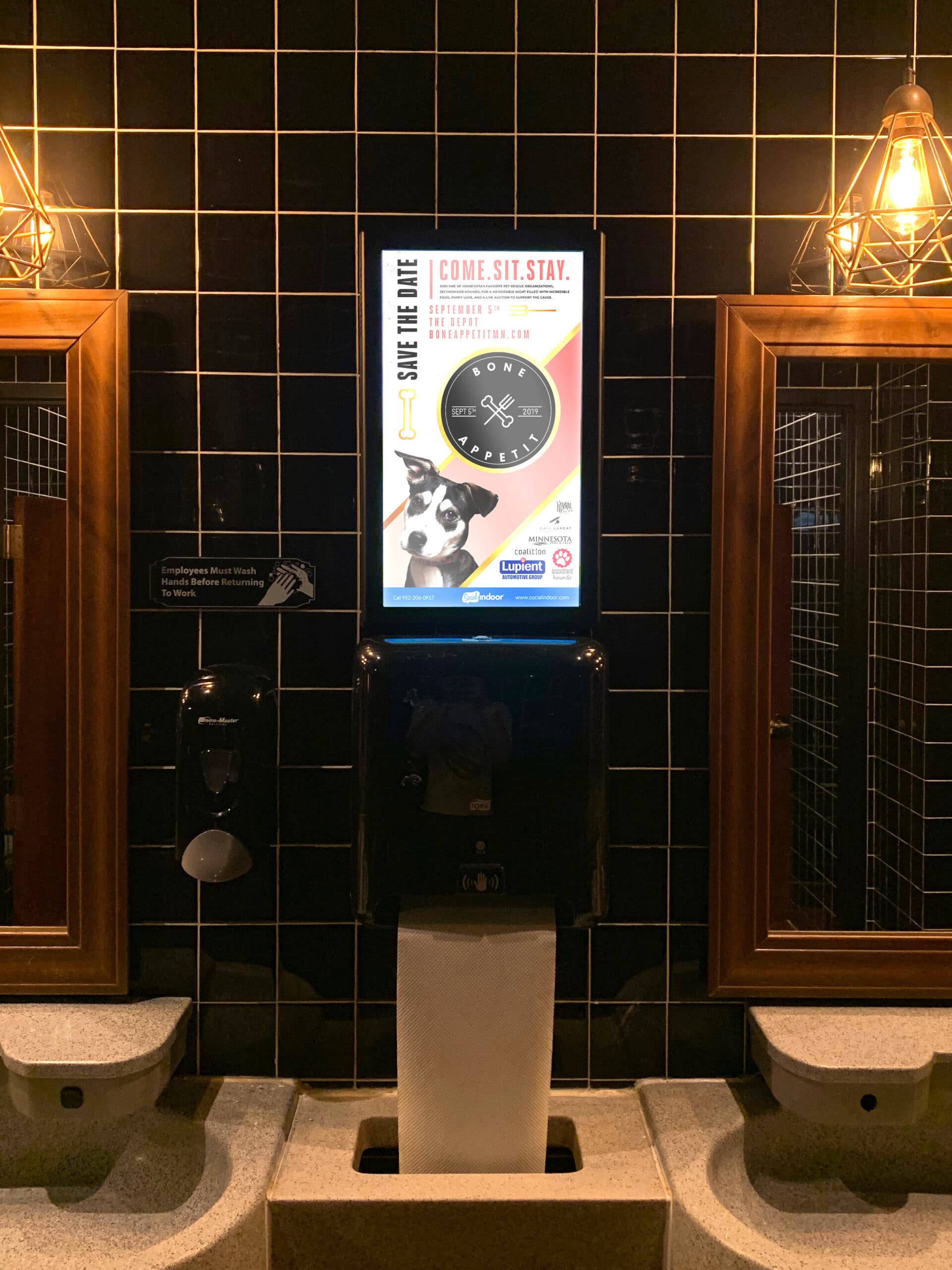 Bathroom with digital advertisement from Social Indoor